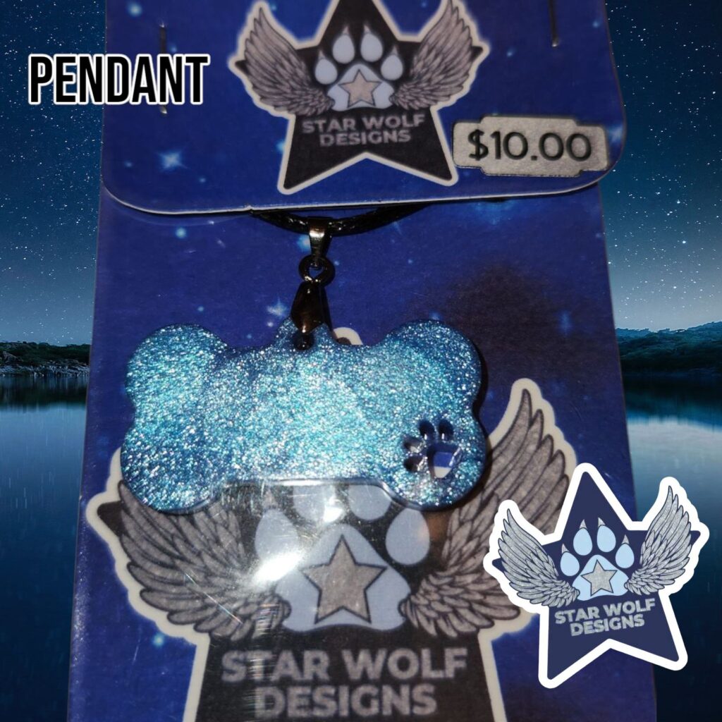 Light blue glitter pendant on a Star Wolf Designs card