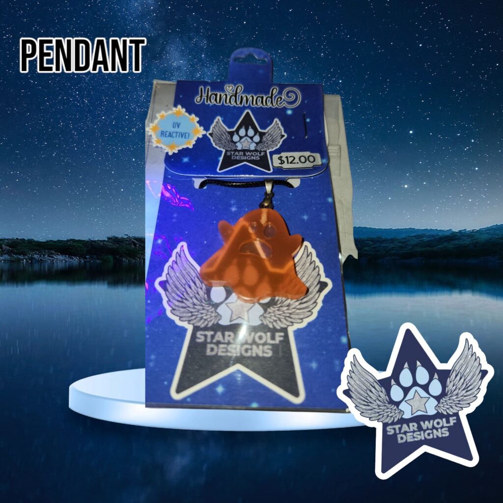 Orange resin pendant on a Star Wolf Designs card