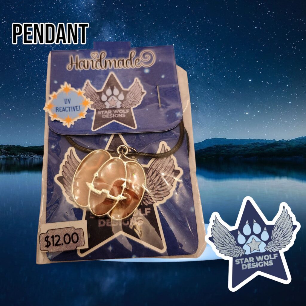 Tan pendant on a Star Wolf Designs card