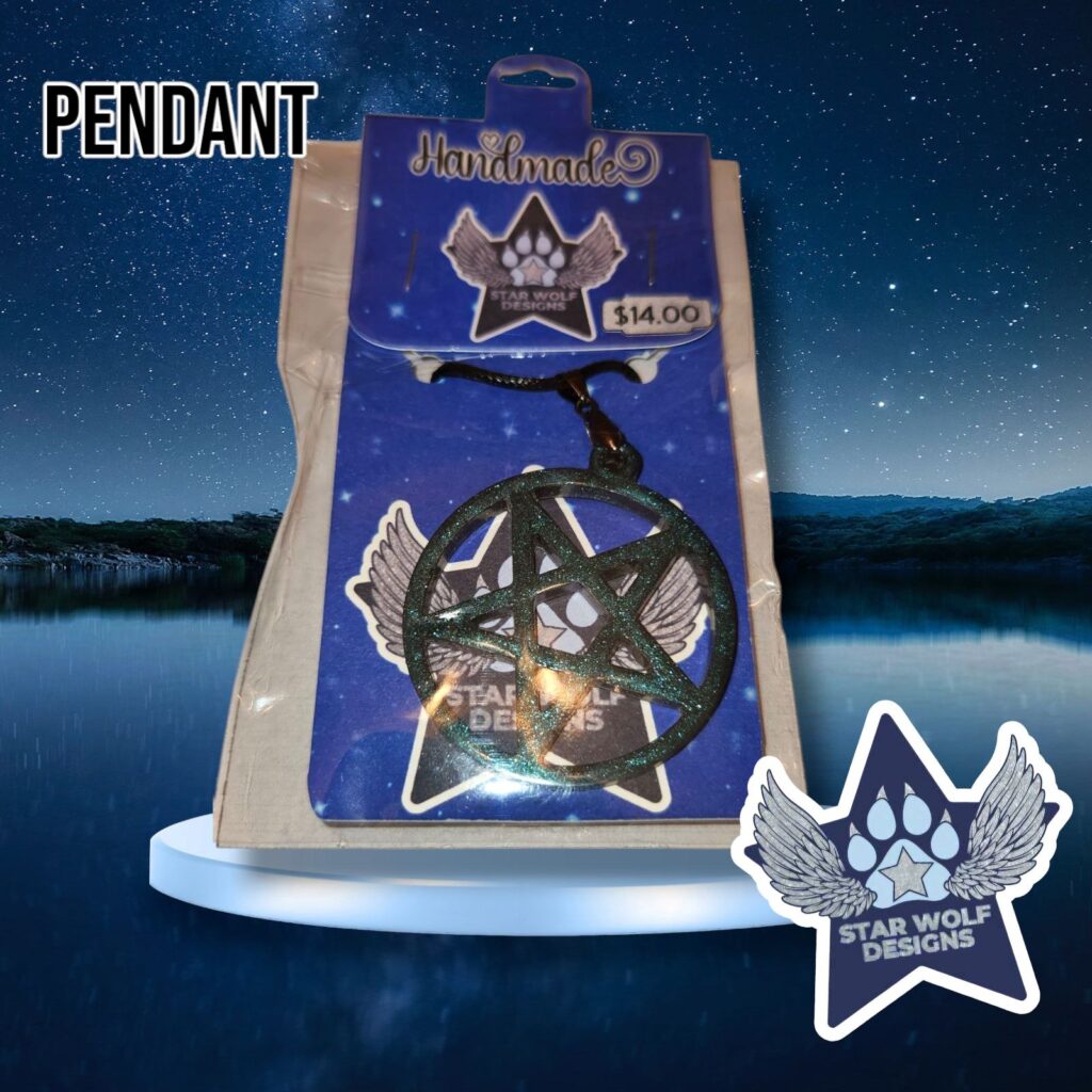 Dark resin pendant on a Star Wolf Designs card