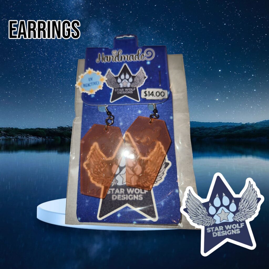 Orange resin earrings on a Star Wolf Designs card