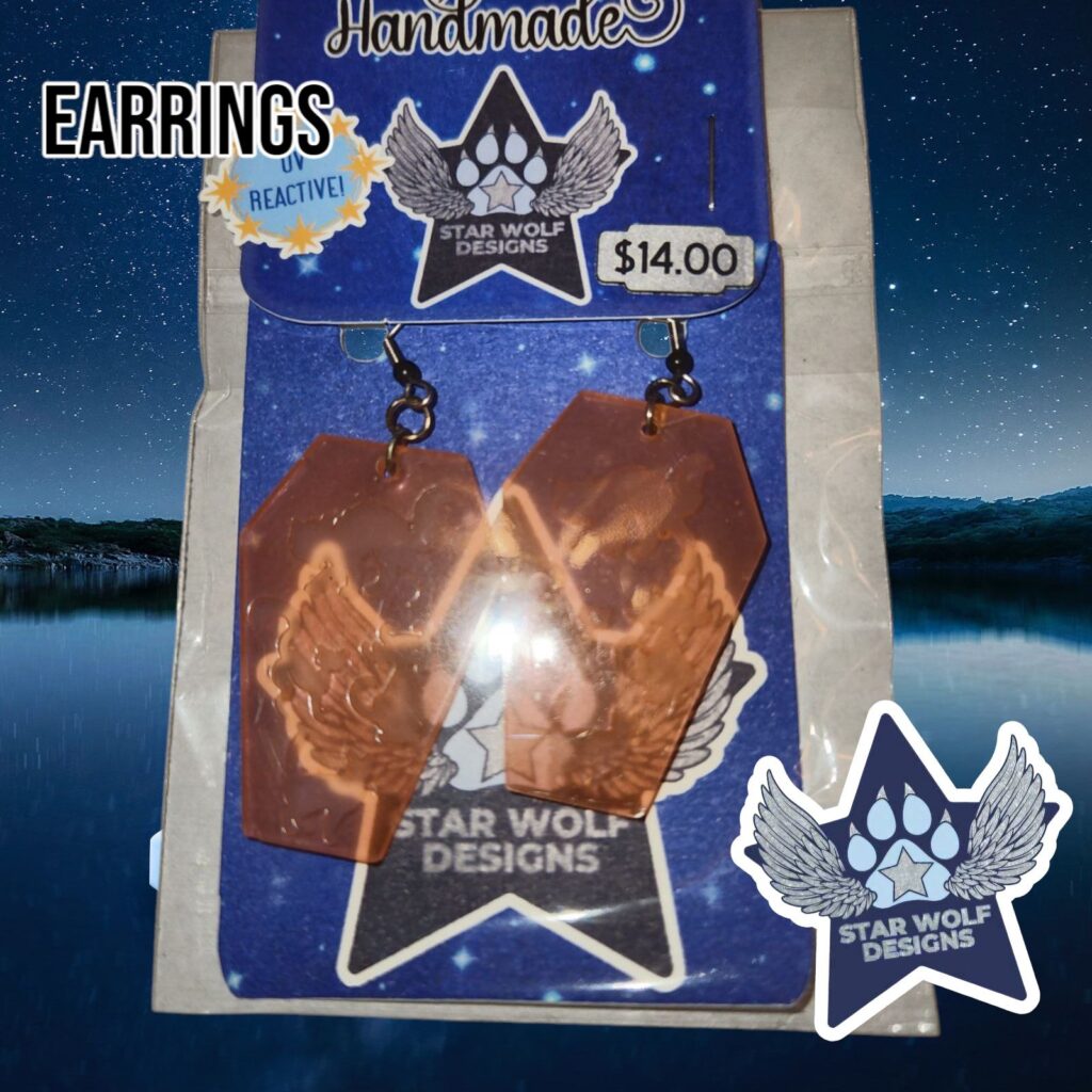 Orange resin earrings on a Star Wolf Designs card