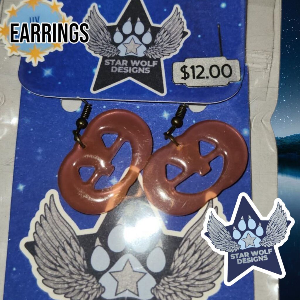 Orange earrings on a Star Wolf Designs card