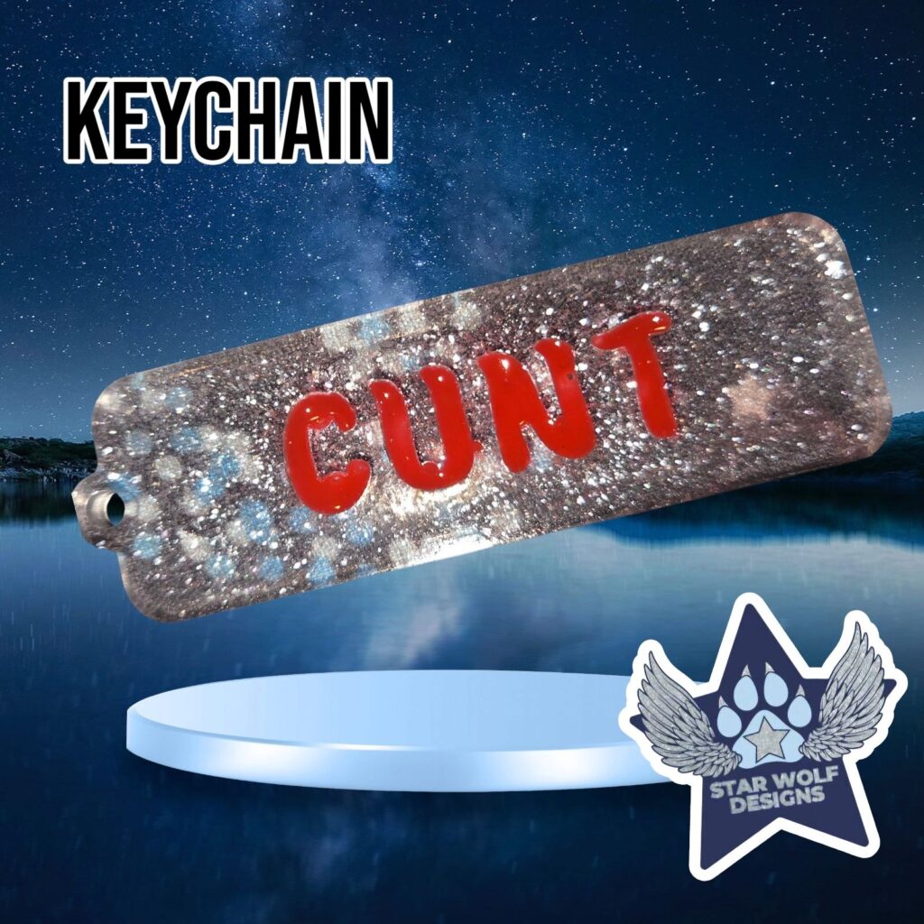 Silver glitter keychain reading “Cunt”